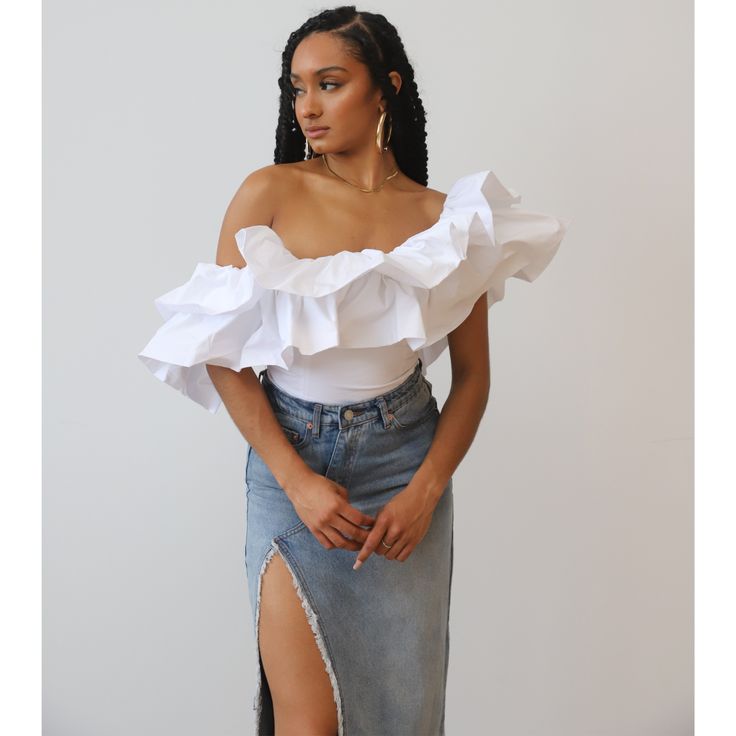 Designed to make a statement, this show-stopping top exudes opulence and style. The asymmetrical silhouette highlights your shoulder and collarbone, while the dramatic ruffles add the perfect unique touch. This attention-grabbing design promises to turn heads in the best of ways. Embrace the extraordinary and exude confidence with our one-shoulder dramatic ruffle top, because sometimes, being extra is just right. Runs small- size up Model is wearing her normal size small Made of 100% Cotton No s Ruffles Top Outfit, Cuban Outfit, Dearly Bethany, Ruffle Tops Outfit, Off Shoulder Ruffle Top, Ruffle Tops, Being Extra, One Shoulder Ruffle Top, Style Types