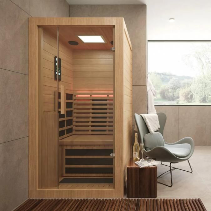 a room with a chair and a sauna in it