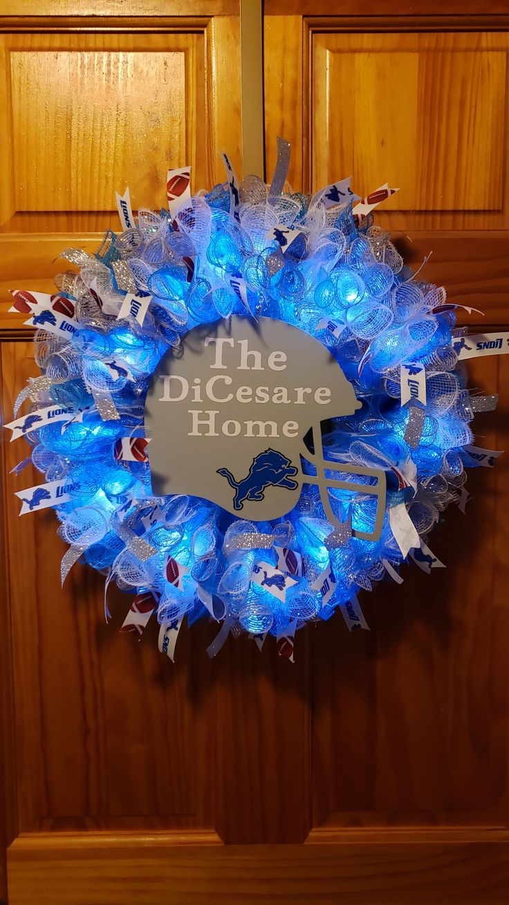 a light up wreath that says the dissesore home with lights on it