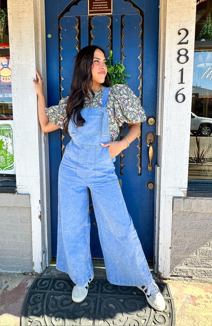 Experience effortless style and comfort with our Easy Choice Wide Leg Overall Jumpsuit! This trendy and versatile piece features adjustable straps with knots for a perfect fit and large pockets. You can keep it simple with a white tee underneath or add some fun with a puff sleeve floral. We recommend getting your true size. Ally is 5'5 and is wearing a size small Hand Wash Cold Hang to Dry 100% Cotton Spring Casual Overalls With Bib Front, Trendy Bib Front Overalls For Spring, Trendy Jumpsuits And Rompers With Suspenders For Spring, Everyday Summer Cotton Jumpsuits And Rompers, Spring Overalls With Adjustable Straps In Relaxed Fit, Relaxed Fit Overalls With Adjustable Straps For Spring, Summer Cotton Jumpsuits And Rompers For Everyday, Spring Overalls With Adjustable Straps And Relaxed Fit, Spring Cotton Jumpsuits And Rompers With Suspenders