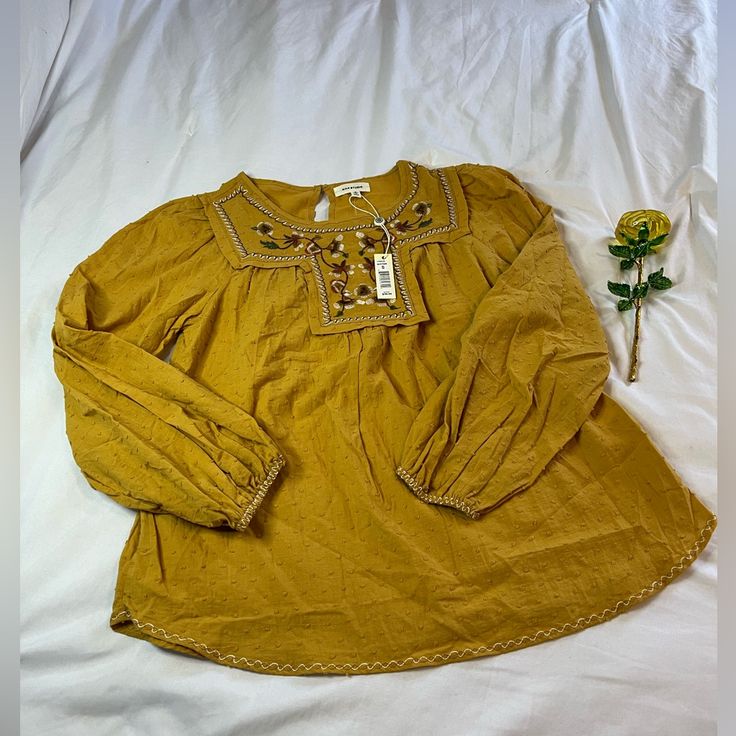 Brand New With Tags Spring Embroidered Gold Top, Embroidered Gold Top For Spring, Gold Embroidered Top For Spring, Yellow Long Sleeve Tops With Floral Embroidery, Yellow Embroidered Tops For Fall, Yellow Embroidered Spring Blouse, Yellow Long Sleeve Cotton Blouse, Yellow Long Sleeve Blouse With Floral Embroidery, Yellow Long Sleeve Peasant Top For Summer