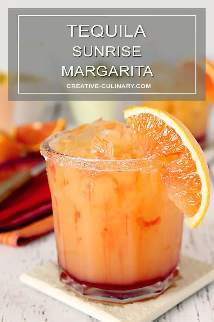 tequila sunrise margarita in a glass with an orange slice