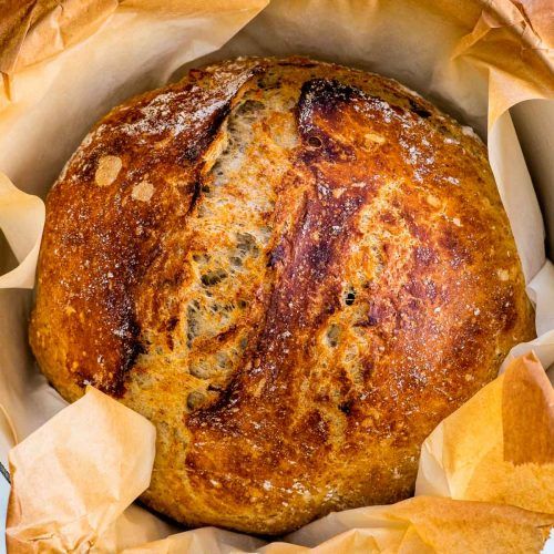 a loaf of bread sitting on top of paper