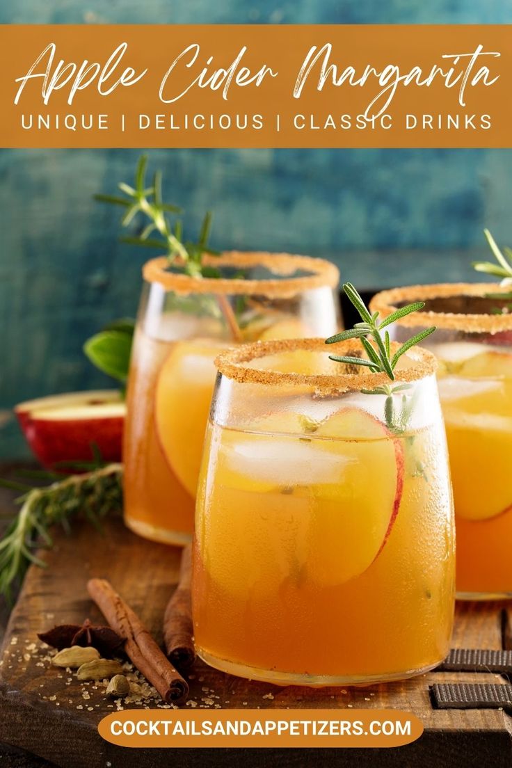 three glasses filled with apple cider margaritas and garnished with rosemary sprigs