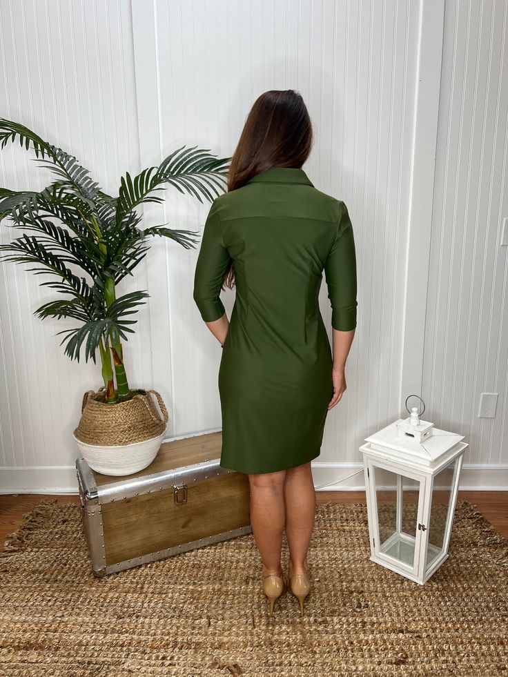 Be polished in this classic shirt dress, which is bound to become a wardrobe essential. In the Jude Cloth fabric. Easy care, easy wear. Made in the U.S.A. Details & Fit: Shirt dress with signature JC buttons. 3/4" sleeves, chest pockets & back darts. Length- 36" from top of center back. (Size S) Model is 5'9 wearing a size S. Fabric & Care: Nylon/spandex. Machine wash only. Do not bleach. Cool iron if necessary. Classic Button-up Shirt Dress With Hidden Buttons, Formal Button-up Shirt Dress With Hidden Closure, Plain Button-up Mini Dress With Button Closure, Green Button-up Shirt Dress With Button Cuffs, Chic Button-up Shirt Dress With Hidden Closure, Barbour Women, Scout Bags, Barbour Mens, Classic Shirt Dress