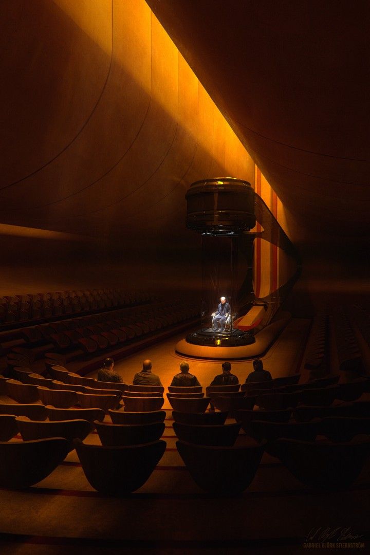 an empty auditorium with rows of seats and a stage in the center, lit by bright lights