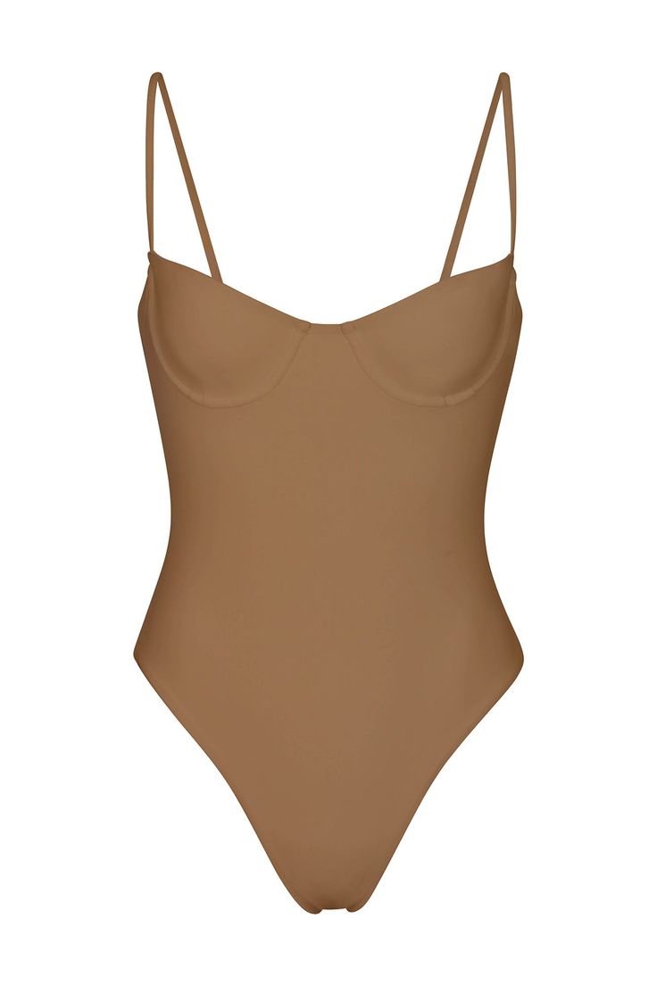 DESCRIPTION The Balconette Underwire One-Piece is the updated maillot version of our signature Balconette Underwire Bikini Top. With the support of the underwire and comfort of adjustable straps, this style is both functional and classic, channeling 90s minimalism and uncomplicated California style. PRODUCT DETAILS Fits true to size UV protected UPF 50+, fully lined Adjustable straps Underwire Slip-on Composition: 90% polyamide, 10% elastane Hand wash and air dry Made in Los Angeles 90s Minimalism, Eco Swimwear, Swimwear Dress, California Style, Swimwear Tops, First World, Upf 50, Dresses For Sale, Adjustable Straps