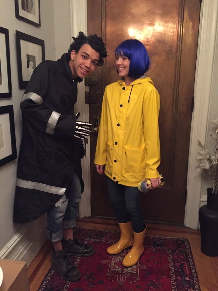 two people standing in front of a door with blue hair and yellow raincoats