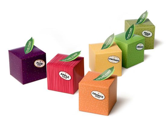 four different colored boxes with green leaves on them