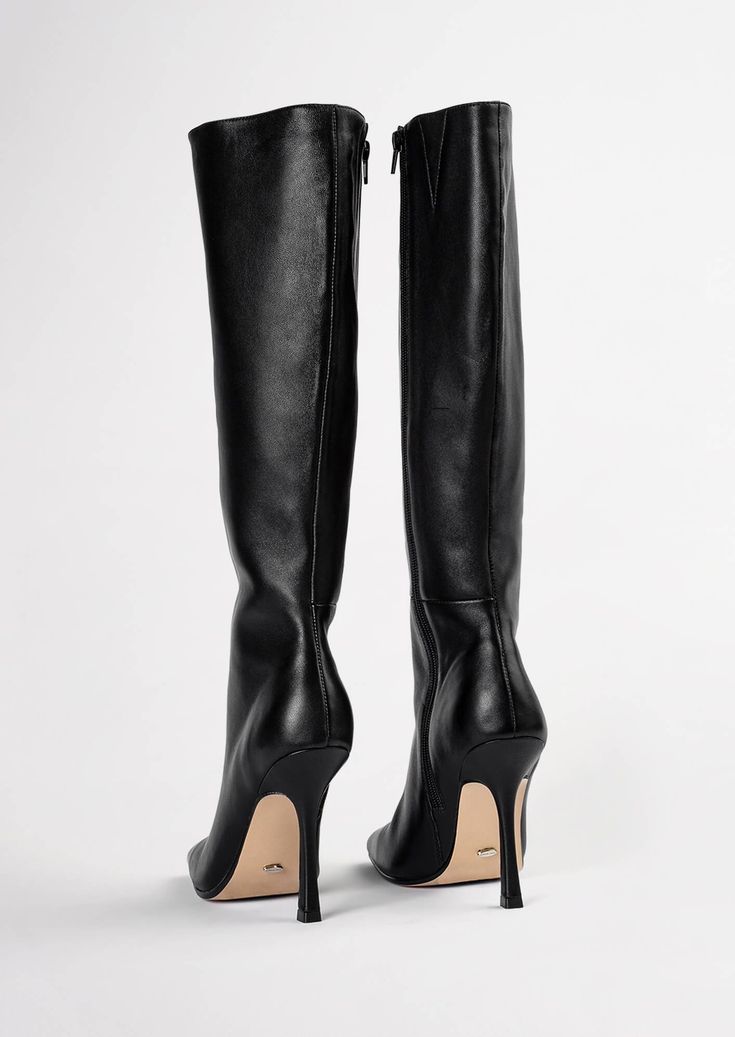 Lending a sleek aesthetic and modern vibes, the Havana knee-high boot is set to impress this AW21. Featuring a slender stiletto heel, an on-trend squared toe and a sleek fitted upper. As a zip-up boot, this style finishes just below the knee. Pair with tucked in pants or a midi-skirt for your next go-to. -Material: ALL NEW Leather Upper & Lining -Sole: Resin sole -Fit: Runs true to size -Toe-shape: Squared -Features: Inner matching zip -Heel: 10.5cm stiletto heel Leg Height x Calf Circumfere Elegant Over-the-knee Boots For Night Out, Fitted Tall Knee-high Boots For Formal Occasions, Formal Fitted Tall Knee-high Boots, Sleek Wide Calf Heeled Boots With High Shaft, Fitted Knee-high Boots With Sculpted Heel, Modern Black Fitted Knee-high Boots, Modern Fitted Black Knee-high Boots, Classic Tall Fitted Heeled Boots, Fitted Tall Boots For Formal Occasions