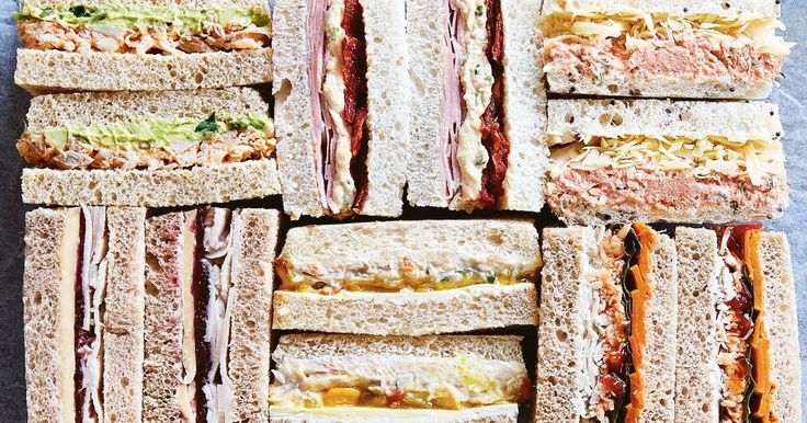 a bunch of sandwiches stacked on top of each other