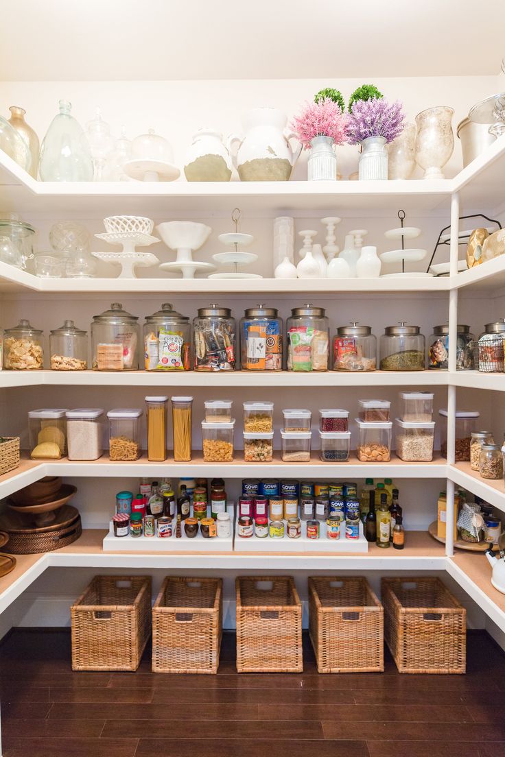 an organized pantry filled with lots of food and containers on the shelve shelves