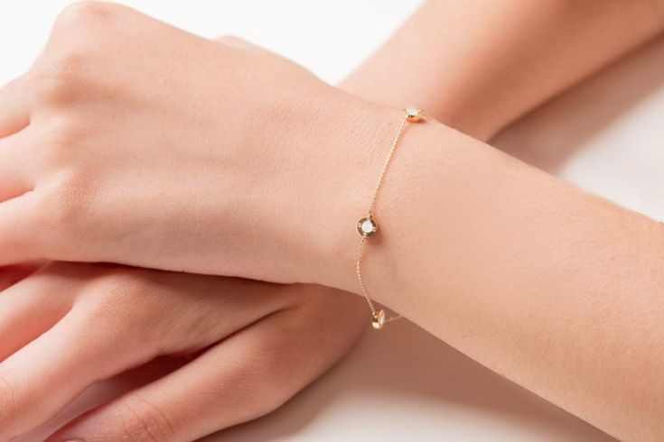 Buy a unique Mother of Pearl circle bracelet for women. | Discover a large collection of everyday sparkling jewels. | ✅ We offer FREE Worldwide Shipping. 📌About the bracelet: Our dainty bracelet is made from 14 karats solid gold and has four circles from mother of pearl and four cubic zirconia stones on each side. The bracelet is double-sided. It is a really shiny and sparkling bracelet that can be worn alone or as part of a layering set. 📏Dimensions approximately: Width circles 5,22 mm, 0,205 Chic Sterling Silver Bracelet As A Gift, Chic Sterling Silver Bracelet Gift, Elegant Everyday Bracelets With Diamond Accents, Elegant Everyday Diamond Bangle Bracelet, Chic Diamond Bracelet For Formal Occasions, Chic Yellow Gold Diamond Bracelet As Gift, Chic Yellow Gold Diamond Bracelet Gift, Chic Formal Diamond Bracelet, Modern Everyday Jewelry With Single Cut Diamonds