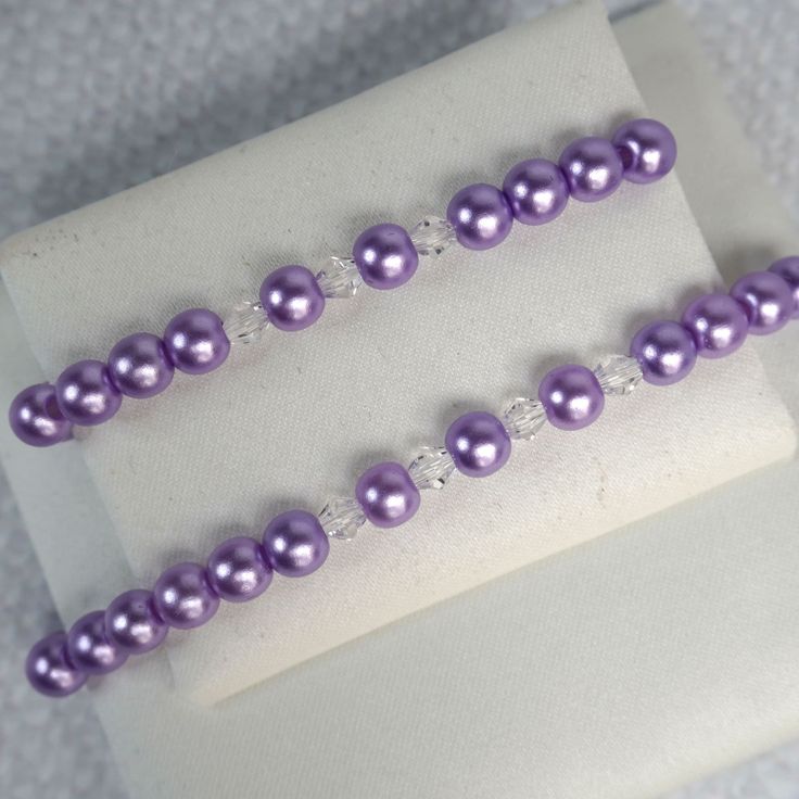 These beautiful matching pearl bracelets are the perfect way to show your love for your mom or daughter. The bracelets are made with freshwater cultured pearls and Austrian crystals. The pearls are a beautiful shade of  purple and the Austrian crystals add a touch of sparkle. These bracelets would be perfect for a special occasion, or for everyday wear. SKU: SET-MC-20-PUR Elegant Purple Pearl Bracelet With Round Beads, Purple Pearl Bracelet As A Gift, Elegant Hypoallergenic Purple Beaded Bracelets, Purple Beaded Pearl Bracelet, Purple Beaded Pearl Bracelets, Elegant Lavender Crystal Bracelet With Round Beads, Wedding Jewelry Bracelets, Freshwater Cultured Pearls, Austrian Crystal