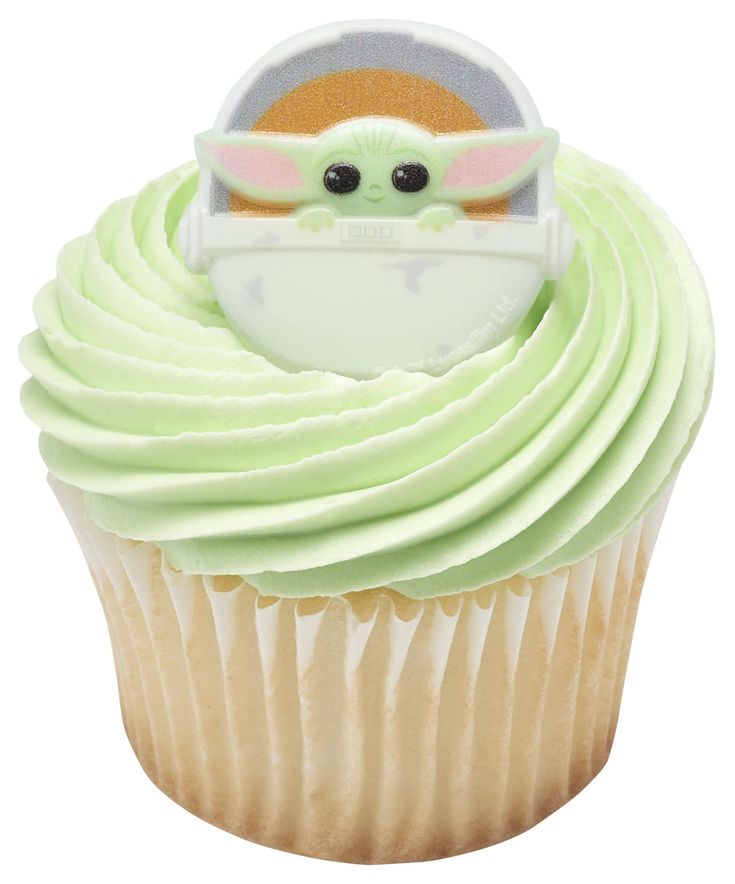 a cupcake with green frosting and a baby yoda on top