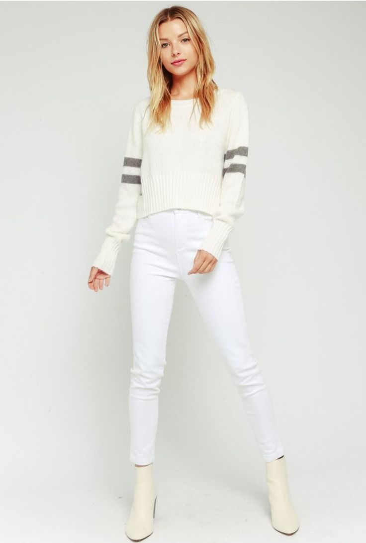 Spend the weekend in the Polly White Striped Crew Neck Sweater! Super soft angora blend off-white knit, accented with grey stripes, shapes a crew neckline, and long sleeves. Cropped bodice gives you that perfect, cozy fit. Trendy Cropped Cotton Sweater, Cropped Cotton Sweater For Fall, Trendy Crew Neck Cropped Sweater For Layering, Trendy Cropped Cotton Sweater For Fall, Trendy Cotton Cropped Sweater For Fall, Winter Layering Cotton Cropped Sweater, Winter Layering Cropped Cotton Sweater, Casual Stretch Cropped Sweater For Layering, Trendy White Crew Neck Cropped Sweater