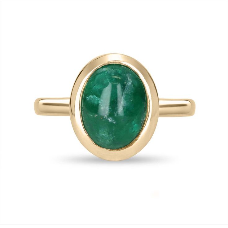 A bezel-set emerald cabochon ring in 14K yellow gold. Featured here is this lovely 3.82-carat natural, earth-mined, emerald cabochon. This stone displays a gorgeous, dark green color, and very good luster. This natural beauty is set in a 14K yellow gold bezel setting. Setting Style: Bezel / Solitaire Setting Material: 14K Yellow Gold Gold Weight: 4.9 Grams Main Stone: Emerald Cabochon Shape: Oval Cut Weight: 3.82-Carats Clarity: Translucent Color: Dark Green Luster: Very Good Origin: Zambia Trea Fine Jewelry Emerald Oval Cabochon Ring, Fine Jewelry Emerald Ring With Oval Cabochon, Heirloom Oval Cabochon Emerald Ring, Yellow Gold Emerald Ring With Oval Cabochon, Yellow Gold Emerald Ring Oval Cabochon, Classic Oval Cabochon Emerald Ring, Formal Yellow Gold Cabochons With Bezel Setting, Oval Cabochon Emerald Ring For May Birthstone, Fine Jewelry Emerald Oval Cabochon Ring For May Birthstone