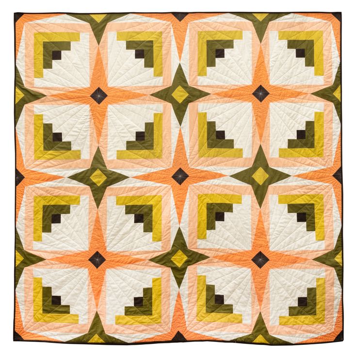 an orange and white quilt with squares in the shape of rectangles on it