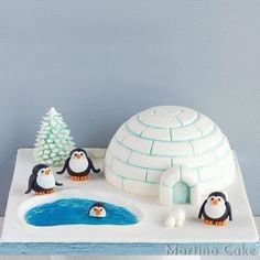 an igloose with penguins and trees on it