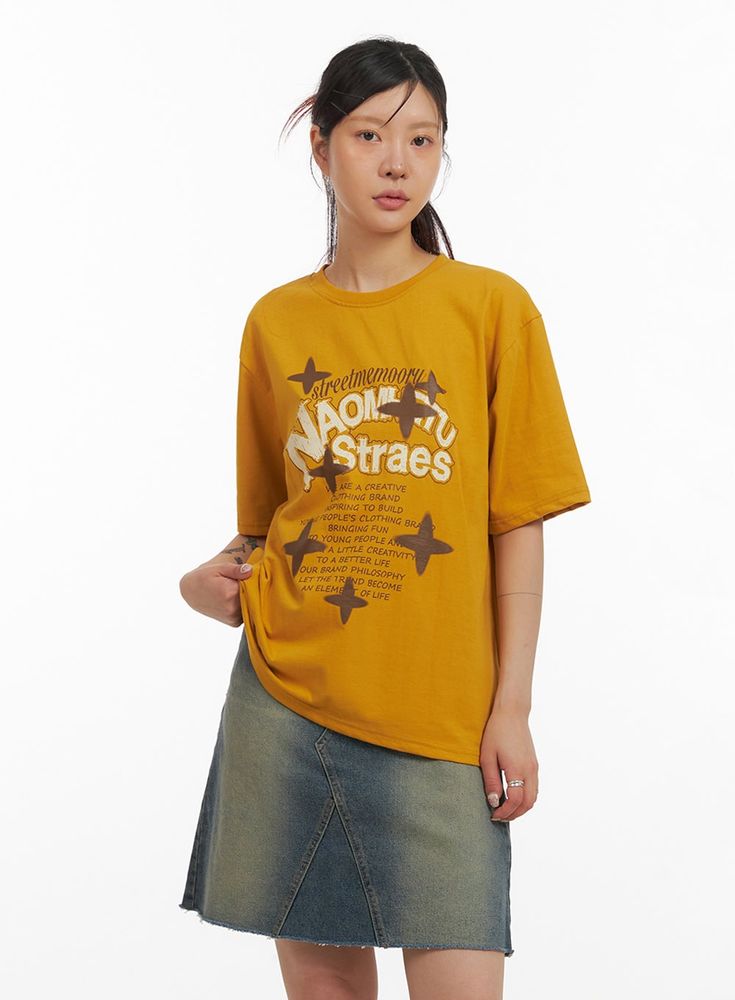 acubi-oversized-graphic-t-shirt-iy410 / Yellow Yellow Casual Tops With Graphic Design, Casual Yellow Tops With Graphic Design, Casual Yellow Top With Graphic Design, Trendy Graphic Design Tops For Everyday, Urban Slogan Tops For Everyday Wear, Retro Oversized Tops For Everyday, Oversized Retro Tops For Everyday, The Color Yellow, Beige Top