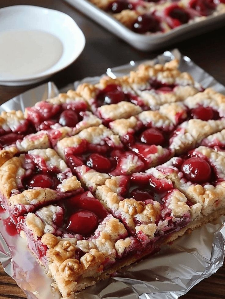 a piece of pie with cherries on it