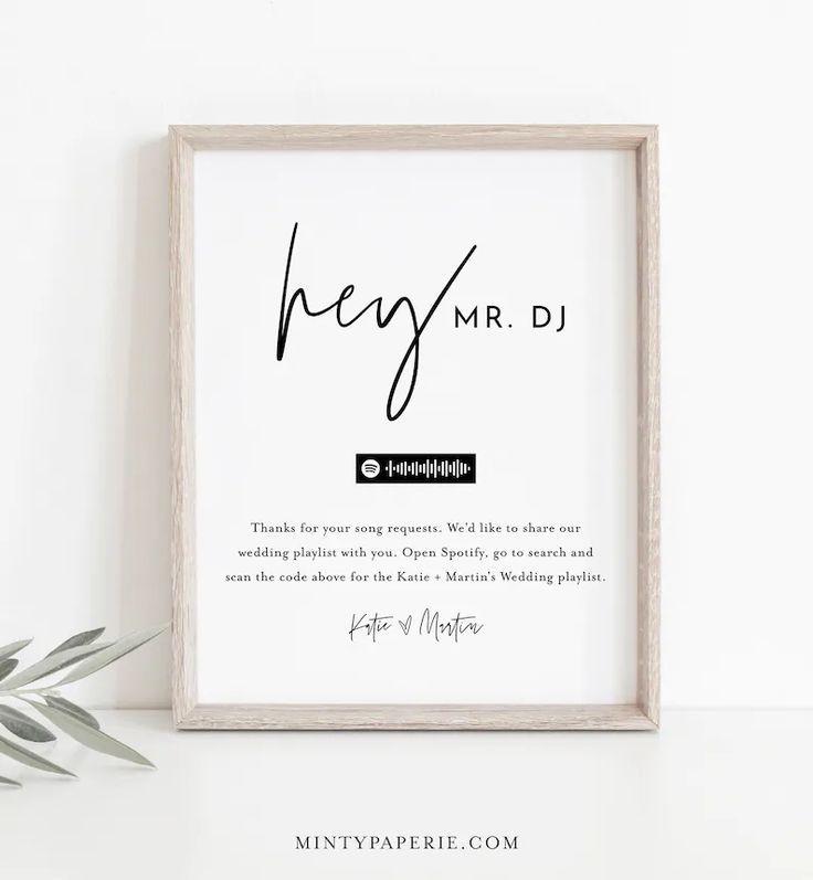 a white framed poster with the words hey mr d on it next to a potted plant