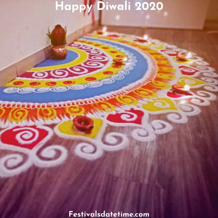 a decorated floor with candles on it for diwali