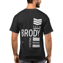 a man wearing a black t - shirt with the words team brody printed on it