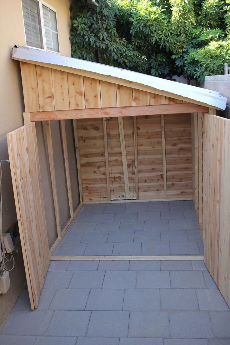 an unfinished garage with the door open