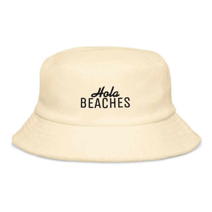 Embroidered Hola Beaches Terry Cloth Bucket Hat, Terry Unisex Beach Hat, Summer Vibes This embroidered bucket hat is super comfortable and stylish. Perfect for the beach or pool, or just to walk your dog. Our terry cloth bucket hats use the highest quality material with advanced embroidery to ensure vibrant colors and detailed graphics.  Product Details: * 100% terry cotton * Classic brim with decorative stitching * Unstructured fit Sizing: One size fits most Processing & Shipping: Your order sh Cotton Bucket Hat For The Beach, Casual Summer Bucket Hat For Pool, Cotton Bucket Hat With Short Brim For Beach, Cotton Sun Hat Cap For Vacation, Adjustable Cotton Bucket Hat For Beach Season, Vacation Bucket Sun Hat, Cotton Cap Sun Hat For Vacation, Casual Flat Brim Hat For Pool, Cotton Beach Bucket Hat With Short Brim