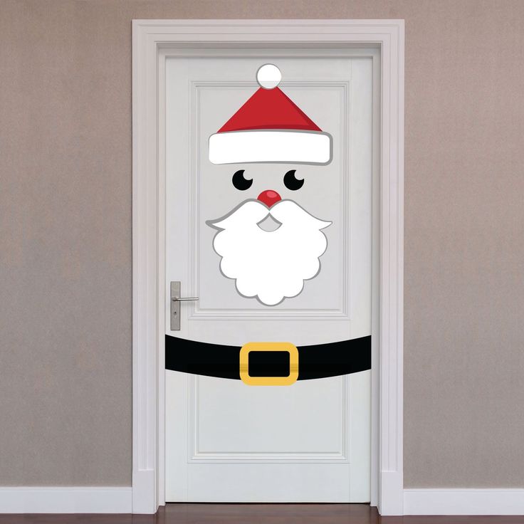 a door decorated with a santa claus face