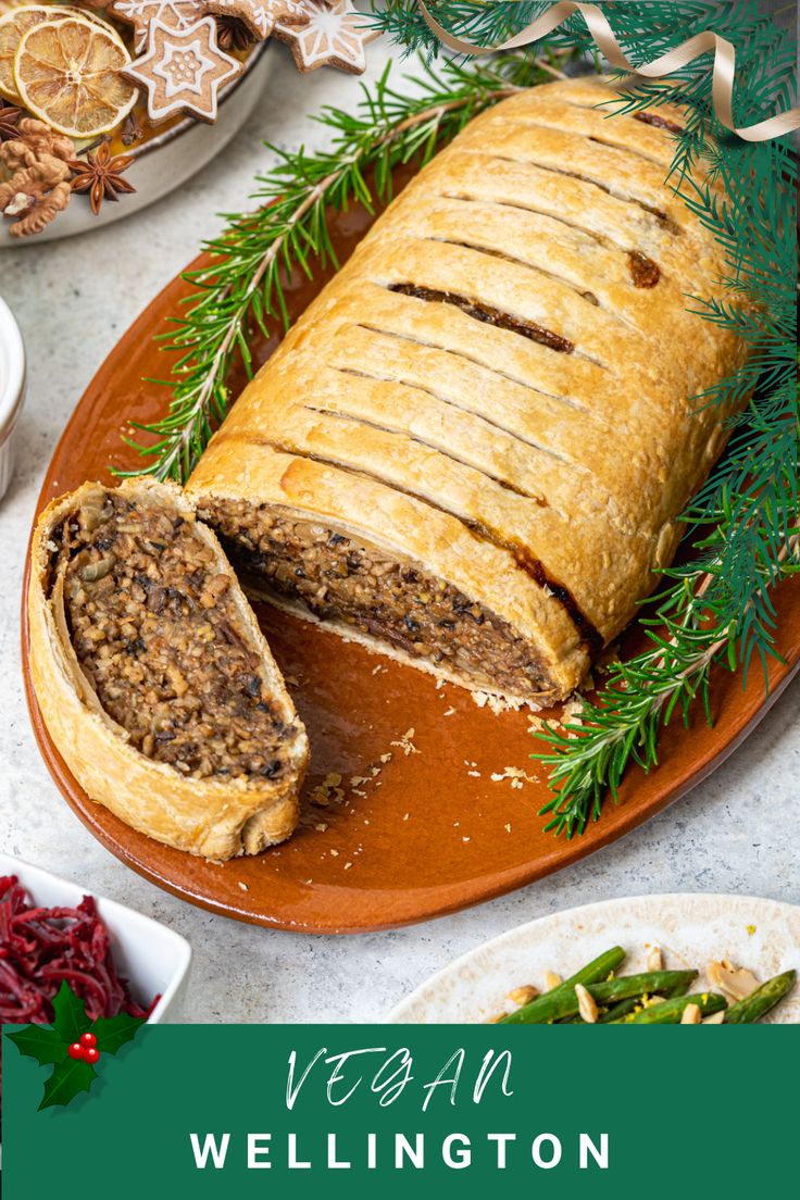 vegan wellington meatloaf on a platter with christmas decorations around it and text overlay that reads vegan wellington