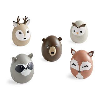 four different types of animal eggs in the shape of animals, with faces painted on them