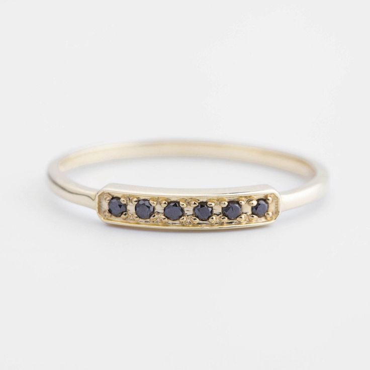 14k gold pave black diamond bar ring featuring .06ctw black diamonds. Each stones are carefully hand set with minimum spacing in between creating maximum sparkle to this ring. It will be great every day ring, perfect for casual outfit to elegant dress. The bar size is 13mm long, band width is 1.3mm. Band width: 1.3mm Stone size: .06ctw Material: 14k yellow, rose or white gold Design name: bar-r105 Lead time: 3 weeks *any specific delivery date, please message me before placing order. Packaging: Wedding Ring Black Diamond, Black Diamond Wedding Ring, Wedding Ring Black, Bee Flowers, Black Diamond Wedding Rings, Modern Wedding Band, Stack Rings, Diamond Stacks, Black Wedding Rings