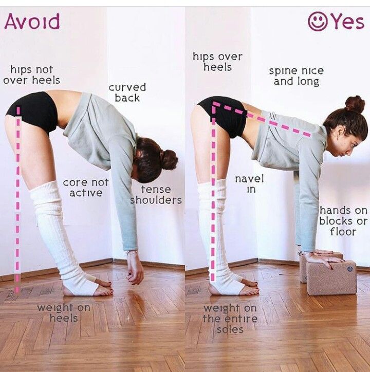 a woman standing on one leg while doing yoga