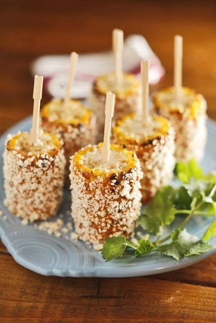 several appetizers on a plate with toothpicks in them