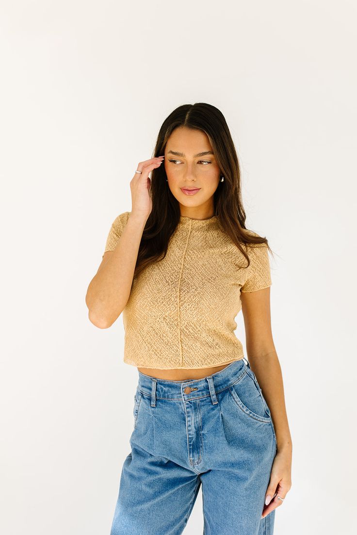 this not-so-basic cropped top will take you from day to night, season after season. made in the perfect neutral tan color, it’s slightly sheer + has a chic high neckline. a must-have ‘going out’ top or elevated basic top to add to your spring // summer wardrobe. tan // high neckline, mesh overlay, attached tank lining, adjustable lining straps, seam detailing, cropped paired with our corbin pleated denim model is 5'8" + wearing a small measurements are approximate + taken while laying flat small Basic Crop Top, Pleated Denim, Spring Summer Wardrobe, Mesh Overlay, Basic Tops, Large Bust, Cropped Top, Tan Color, High Neckline