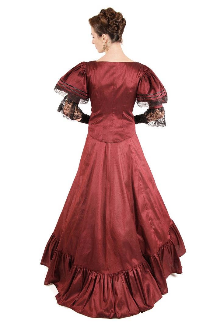 Catch the eyes of many donning the fashion of the Victorians! What a delight! The lovely 19th century styled jacket has front button closure. The poufed oversleeves are trimmed in lace as well as the undersleeves. The graceful skirt is finished with a wide flounce at the hem and can be worn as shown, with a train, or tied up to create bustle. Skirt has elastic waist. Dry clean. Polyester dupioni. Acetate underskirt. Poly lace trim. The model is wearing a crinoline, jewelry and gloves which are p Regency Style Victorian Lace Dress With Historical Design, Victorian Dress With Ruffles And Fitted Bodice, Victorian Dress With Buttons For Costume, Historical Victorian Dress With Buttons, Classic Victorian Dress For Costume With Fitted Bodice, Classic Victorian Dress With Fitted Bodice For Costume, Regency Style Victorian Dress With Ruffles For Formal Occasions, Victorian Dress With Lace Trim For Evening, Victorian Evening Dress With Lace Trim