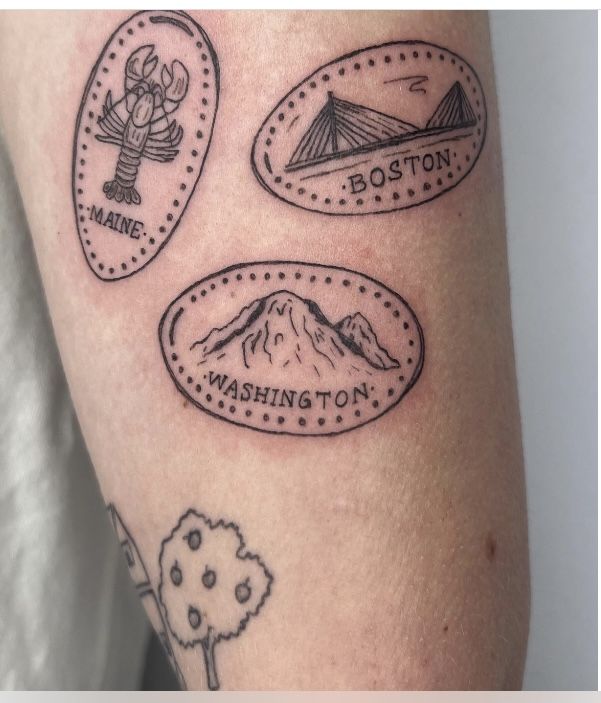 three different tattoos on the legs of someone's arm, one with an image of a bridge and another with a mountain