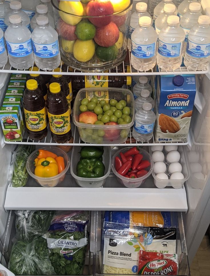 an open refrigerator filled with lots of food