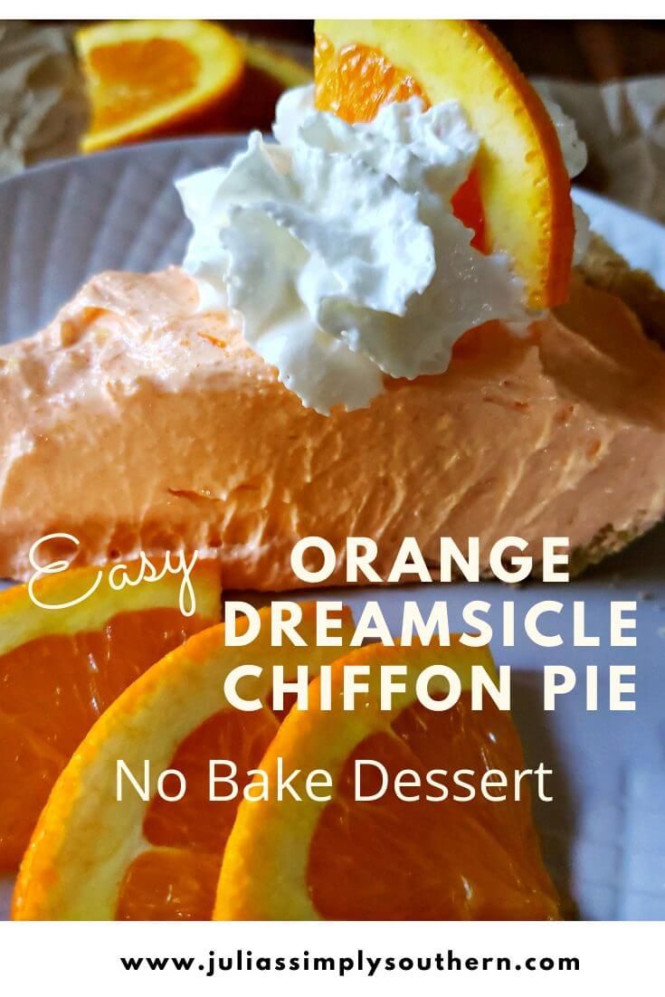 an orange dessert with whipped cream on top and sliced oranges in the background text reads easy orange dreamsice chiffon pie no bake dessert