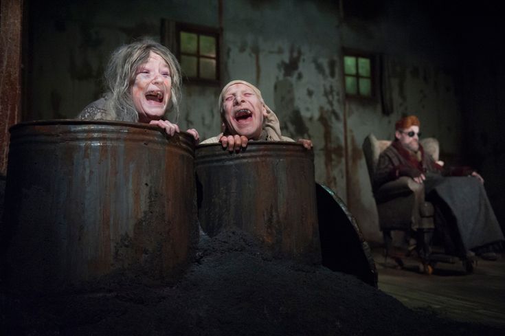 two women in barrels with their mouths open