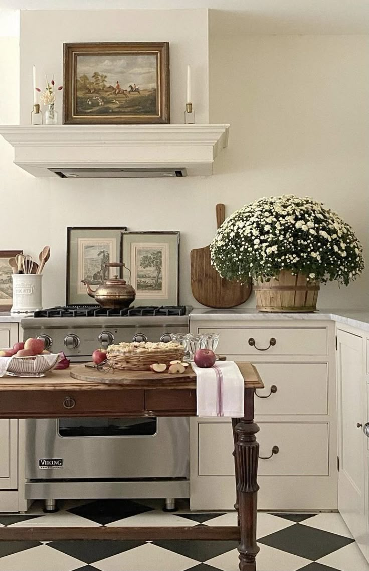 the kitchen is clean and ready to be used for cooking or baking, as well as fresh flowers