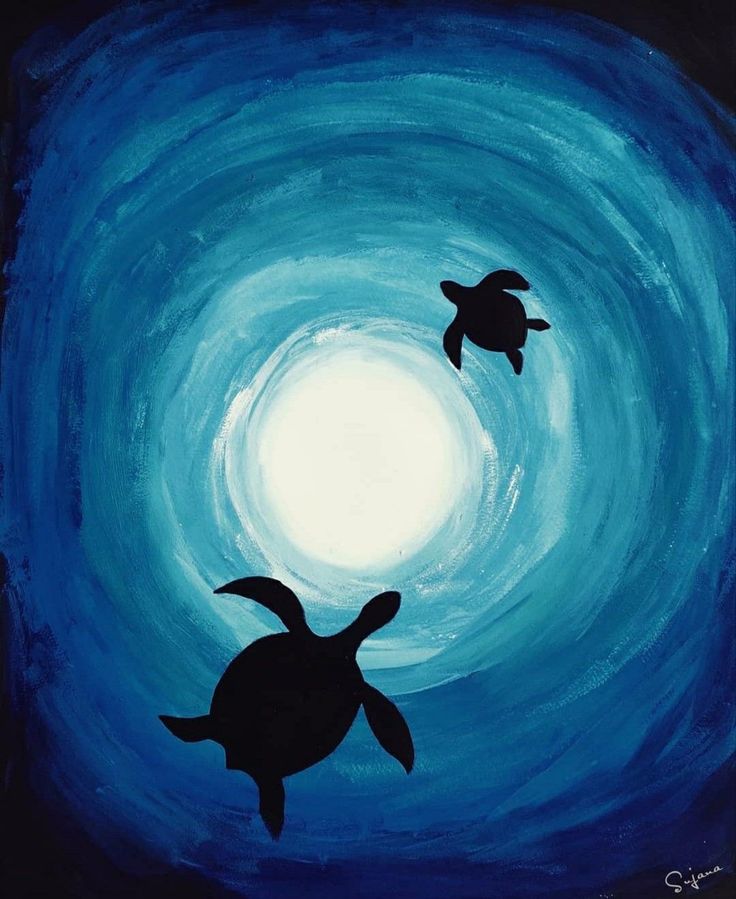 two sea turtles swimming in the ocean at night