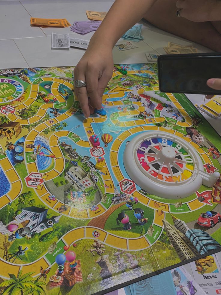 a person playing a board game on the floor