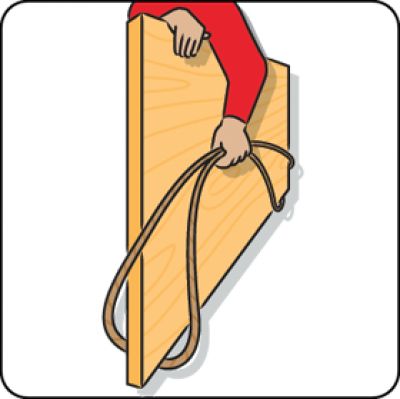 a person is holding on to a wooden plank with a rope around their ankles and pulling it up