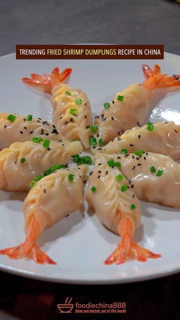 some dumplings are on a white plate with green sprinkles and seasoning