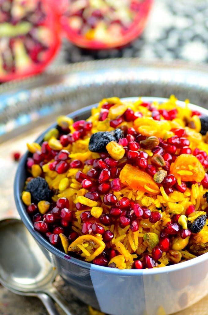 a bowl filled with fruit and nuts on top of a table