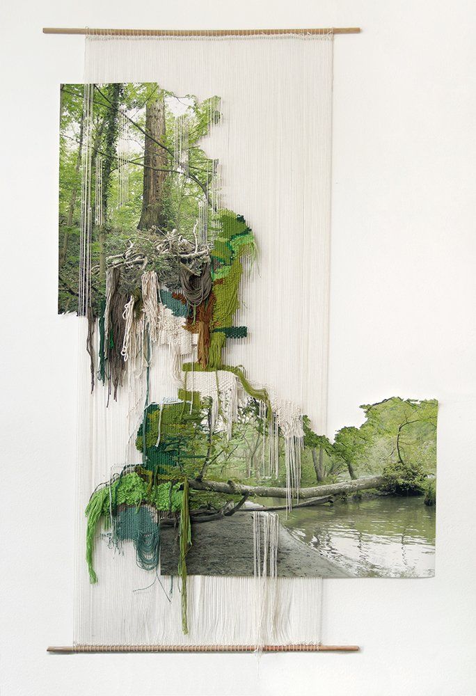 an abstract painting with trees and water in the foreground, on a white wall