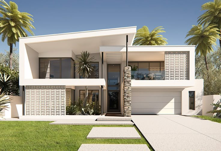 a modern house with palm trees in the back ground and grass on the front lawn